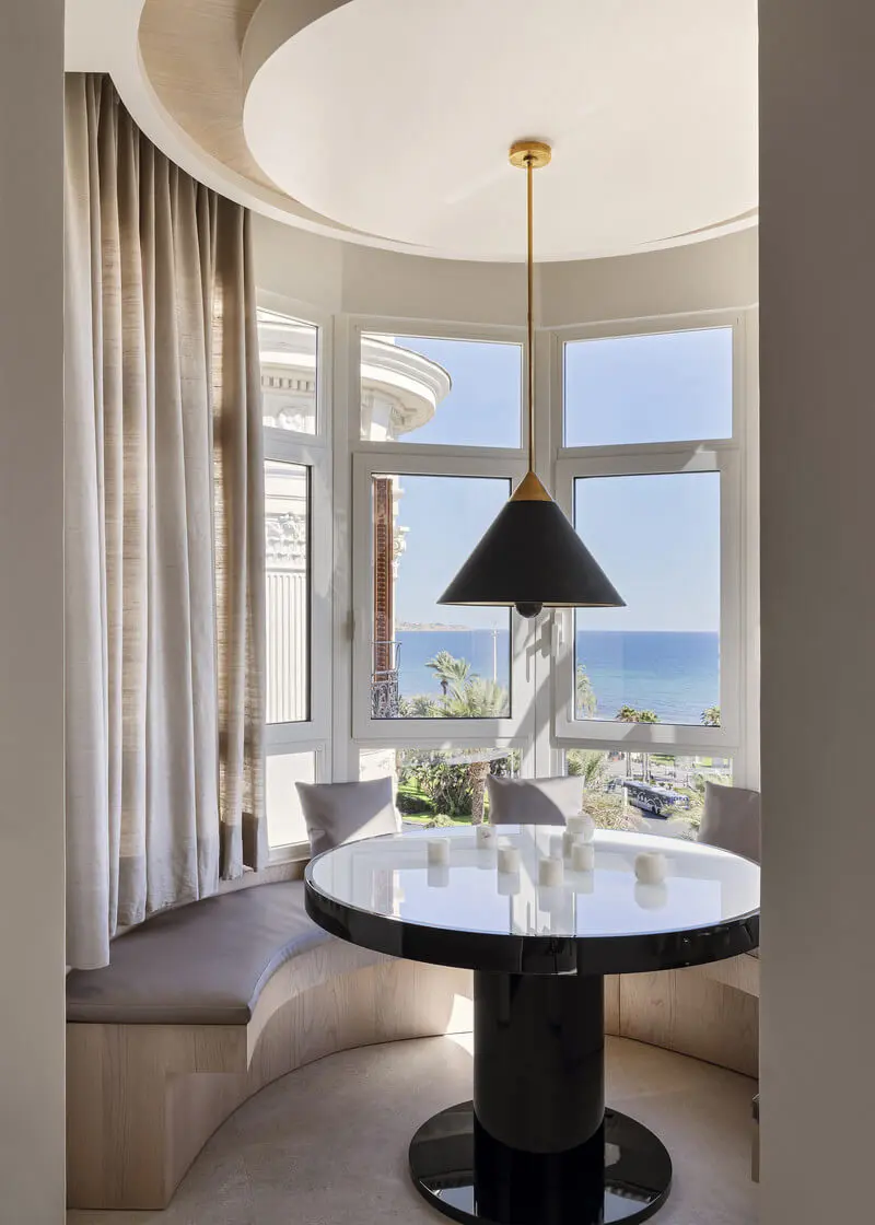 A small dining nook by the window with views for the sea