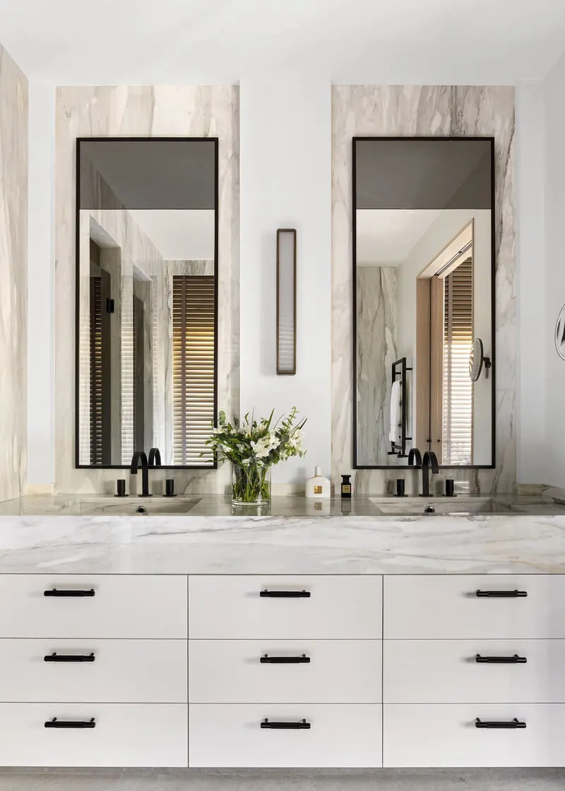 bathroom in white tones with marble features