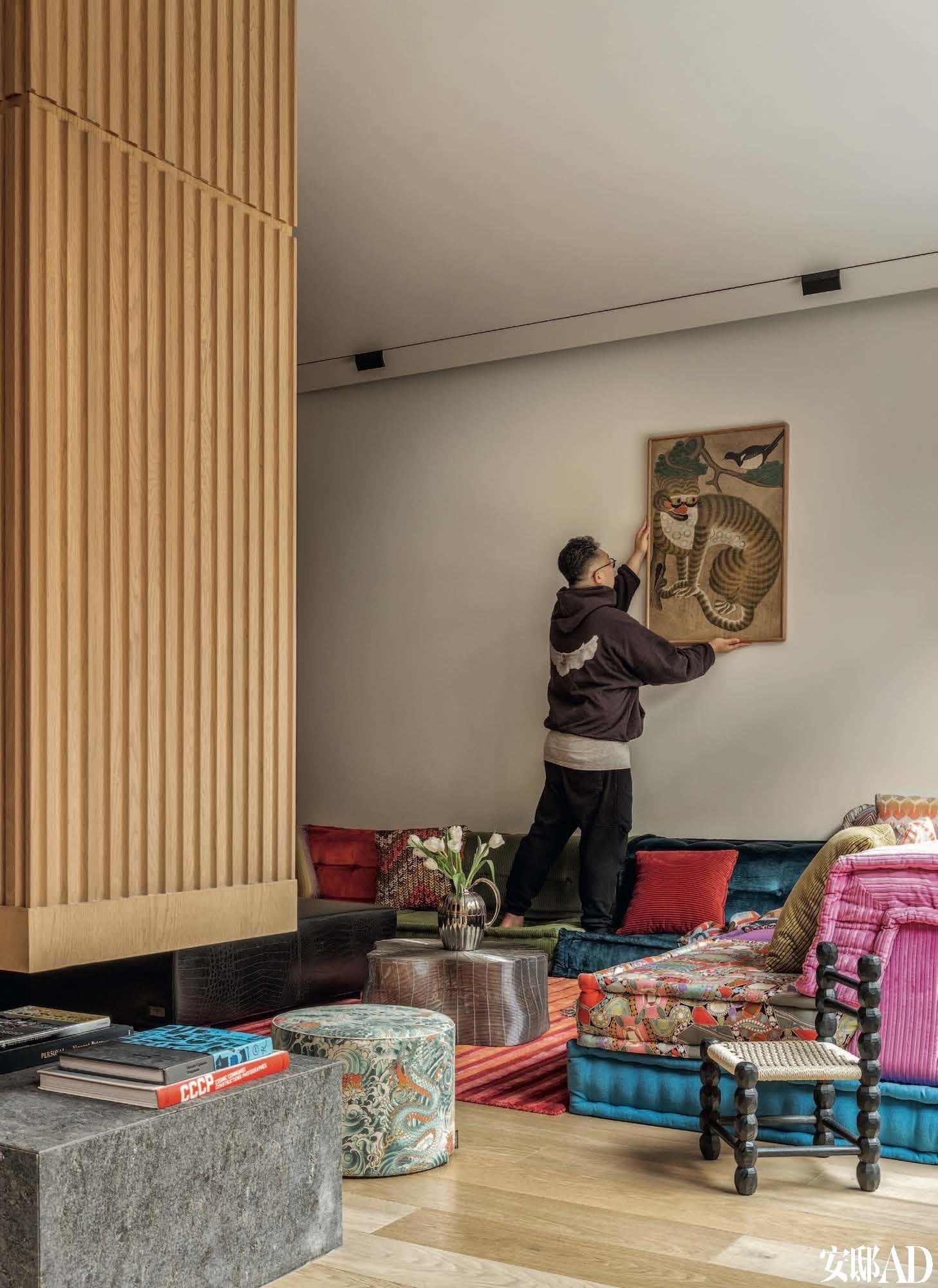 Eclectic Modern Interior Design for Family Living, living room with eclectic art, carpet and unique sofa