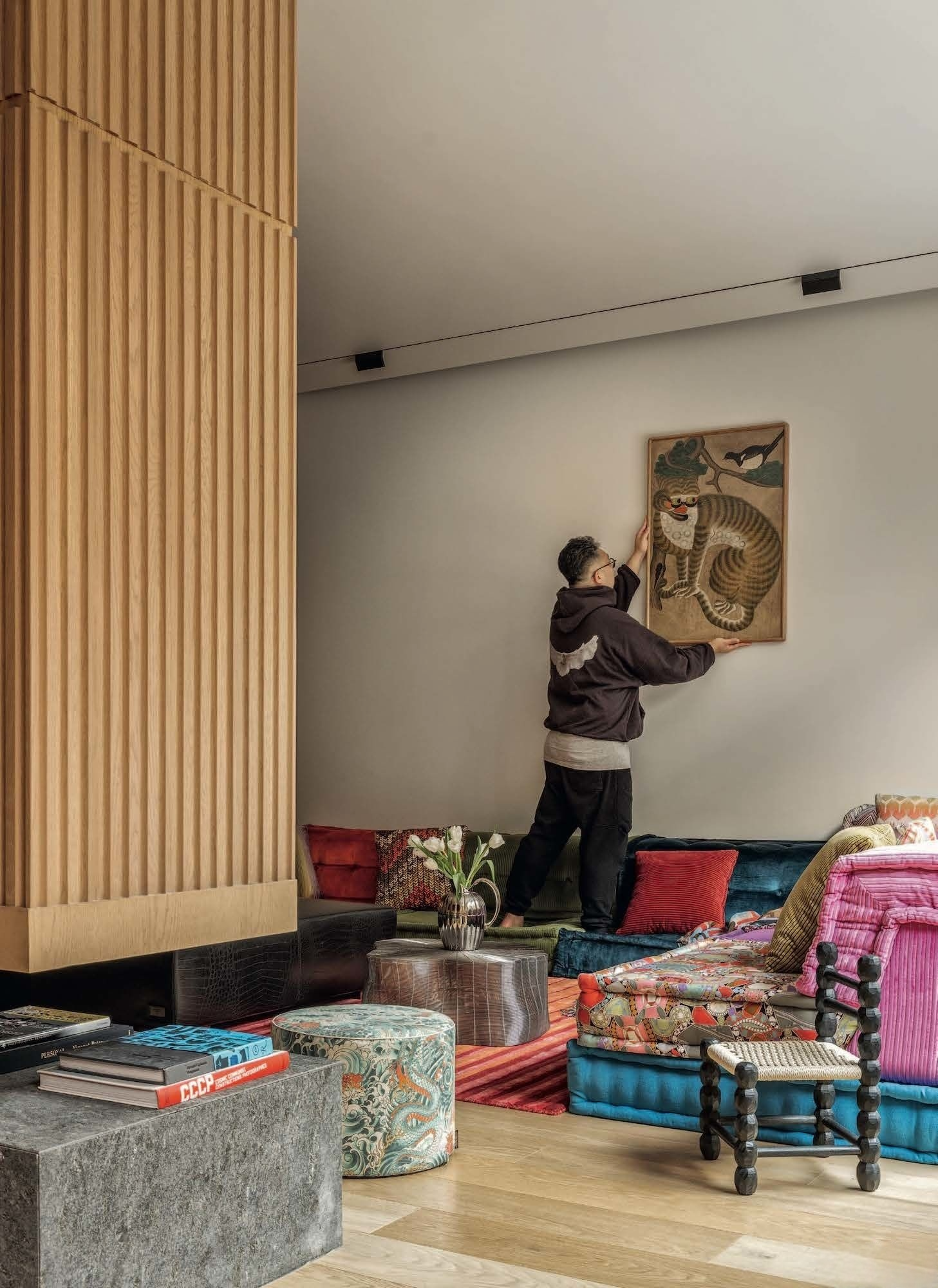 Eclectic Modern Interior Design for Family Living, living room with eclectic art, carpet and unique sofa