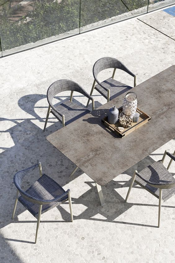 Grey rectangular table and chairs in outdoor area