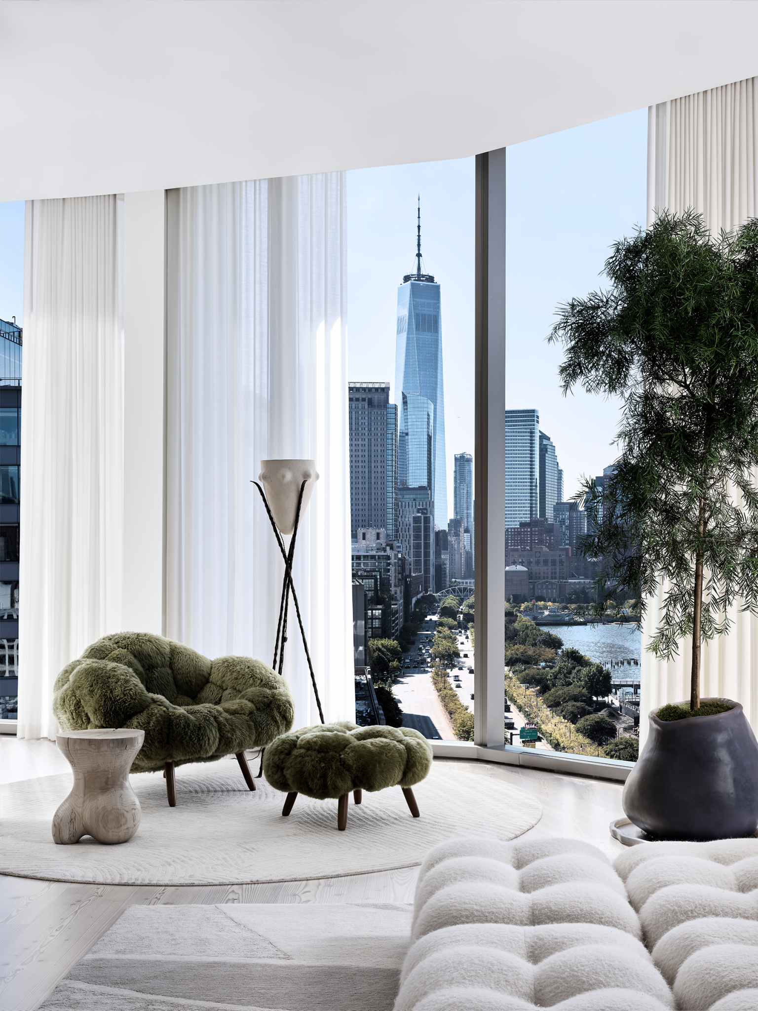 Modern living room in neutral tones featuring a pistachio green seating