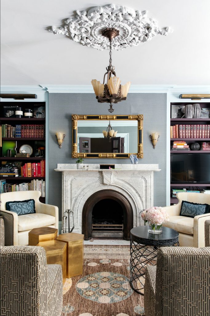 maximalist interior living room with a stunning fireplace