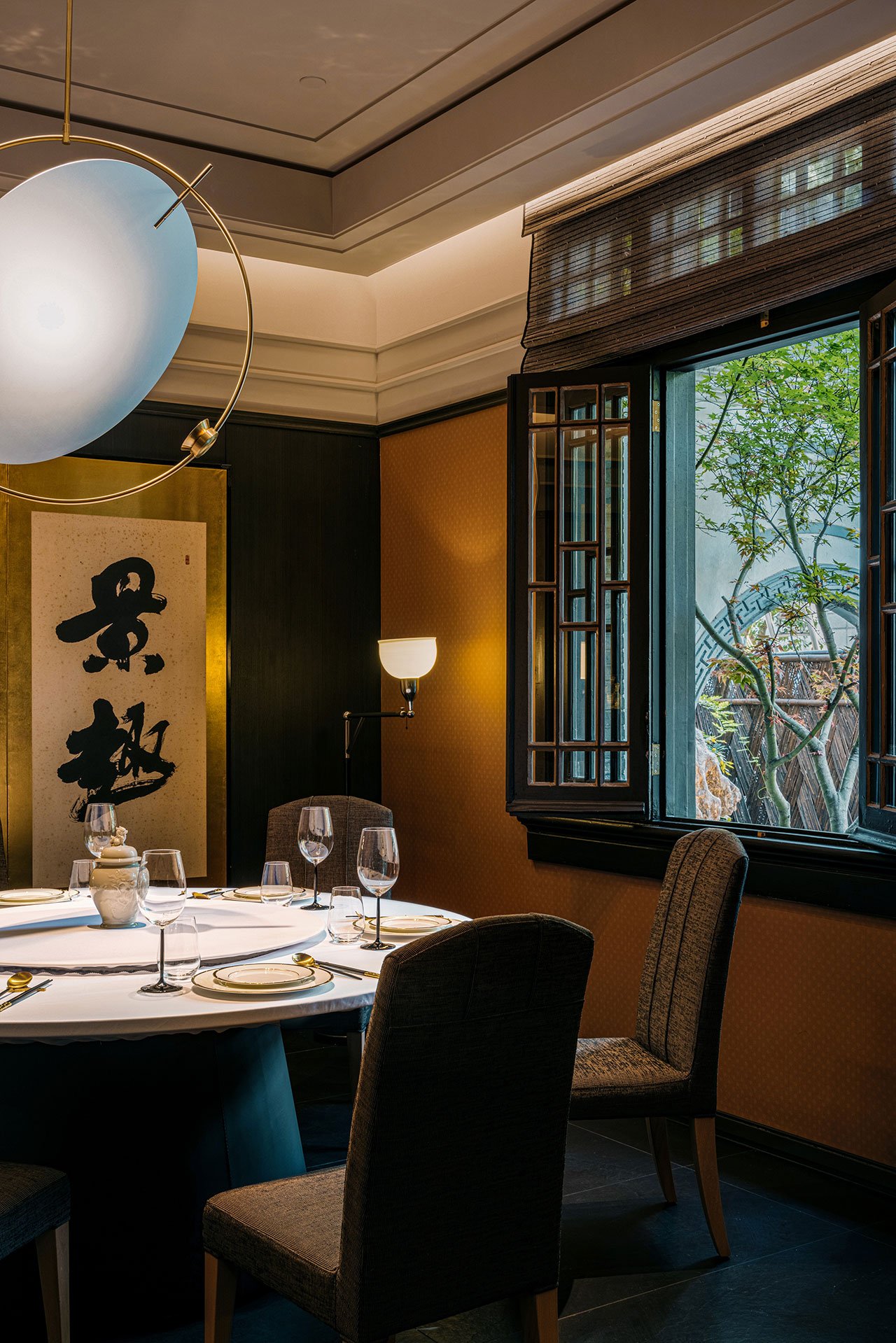 Dining room featuring chinese writing on the wall