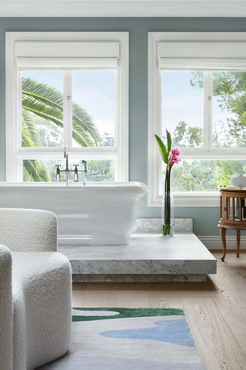 main bathroom featuring a curved sofa at its center