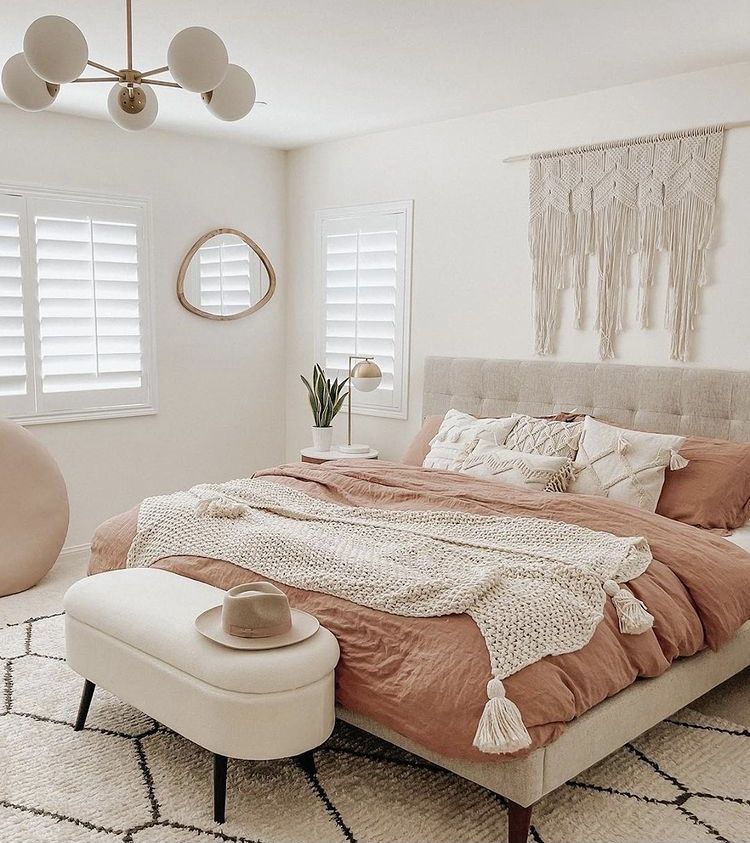 neutral bedroom with a pop of pink