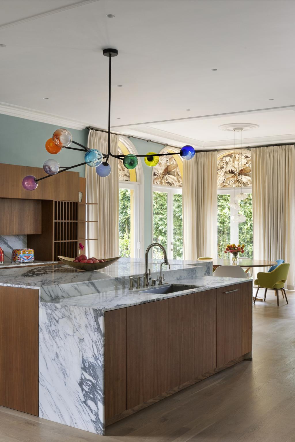 kitchen featuring a suspension lamp with delicately crafted glass spheres in a kaleidoscope of vivid hues