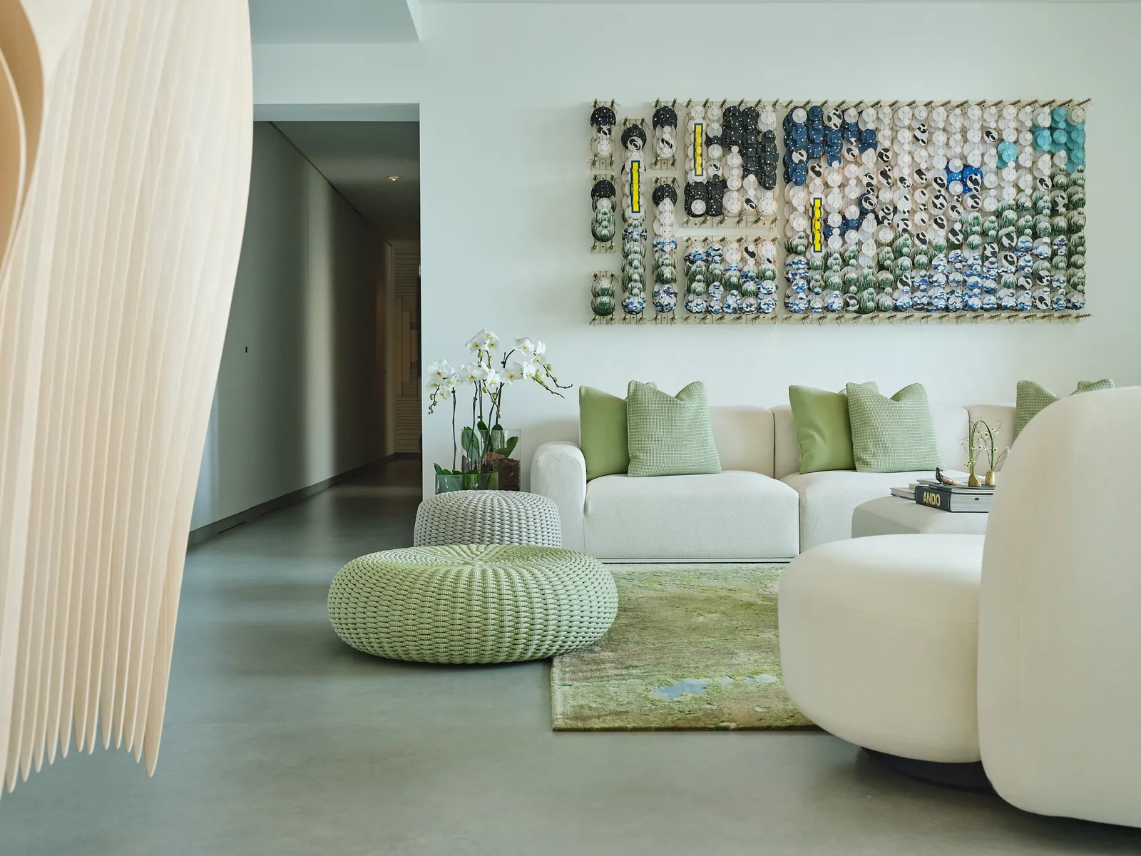 The Art of Minimalist Luxury: Inside a Dubai Penthouse Inspired by Nature , living room with art work, rug, sofa and designed unique furniture