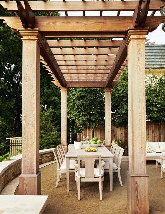 Outdoor dining area underneath a wood cover