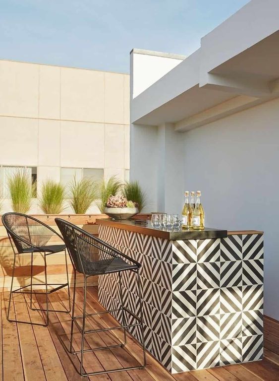 Outdoor bar with a tile kitchen island