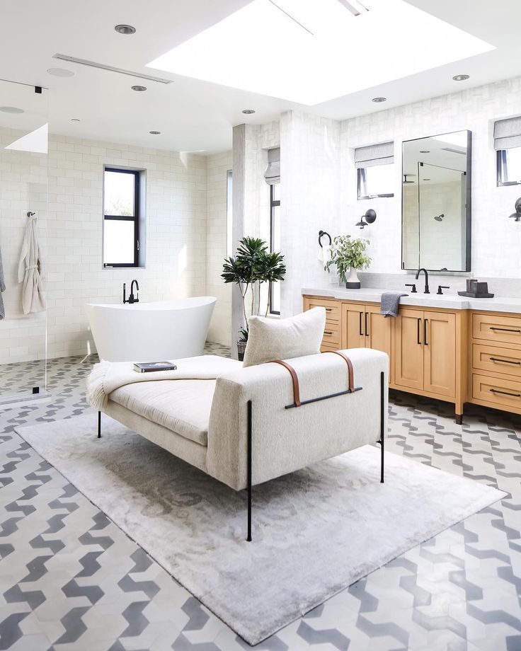 Modern daybed in the center of a neutral toned bathroom