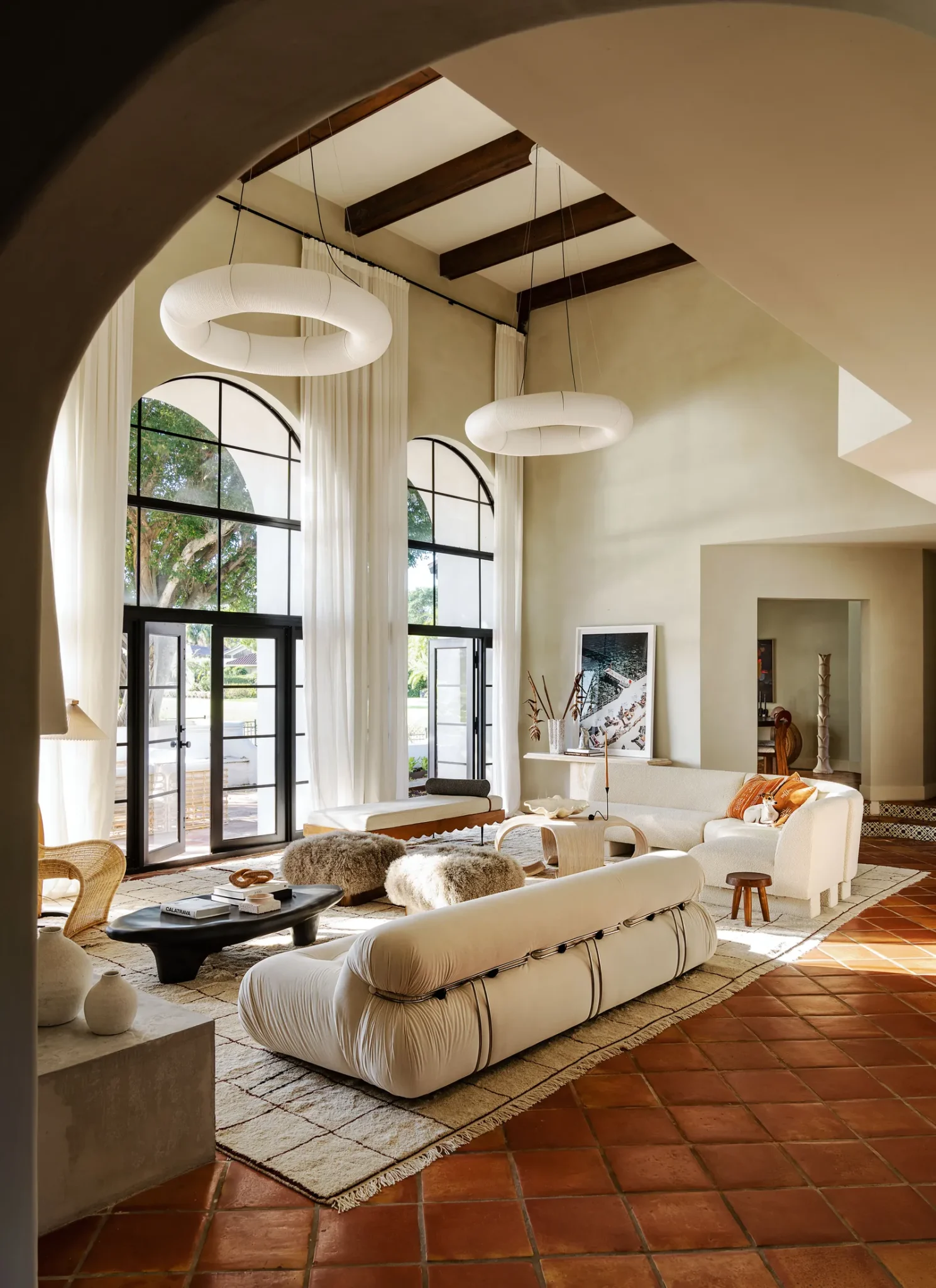 open and airy living room featuring amazing arched windows