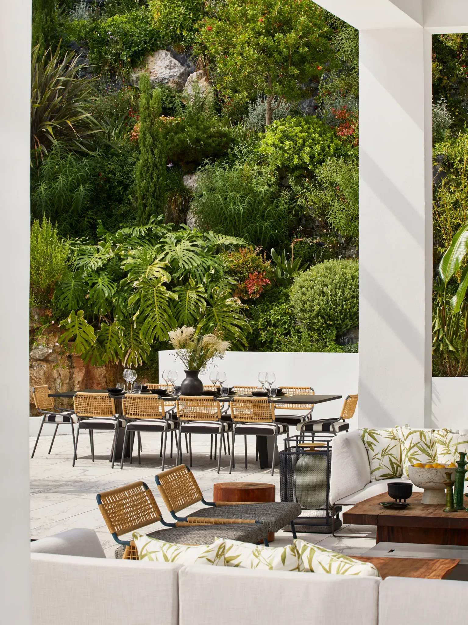 outdoor area featuring a dining and living areas in the mediterranean style of the Cannes villa design