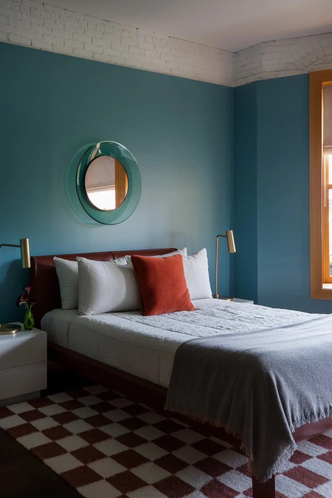 Modern bedroom with turquoise walls