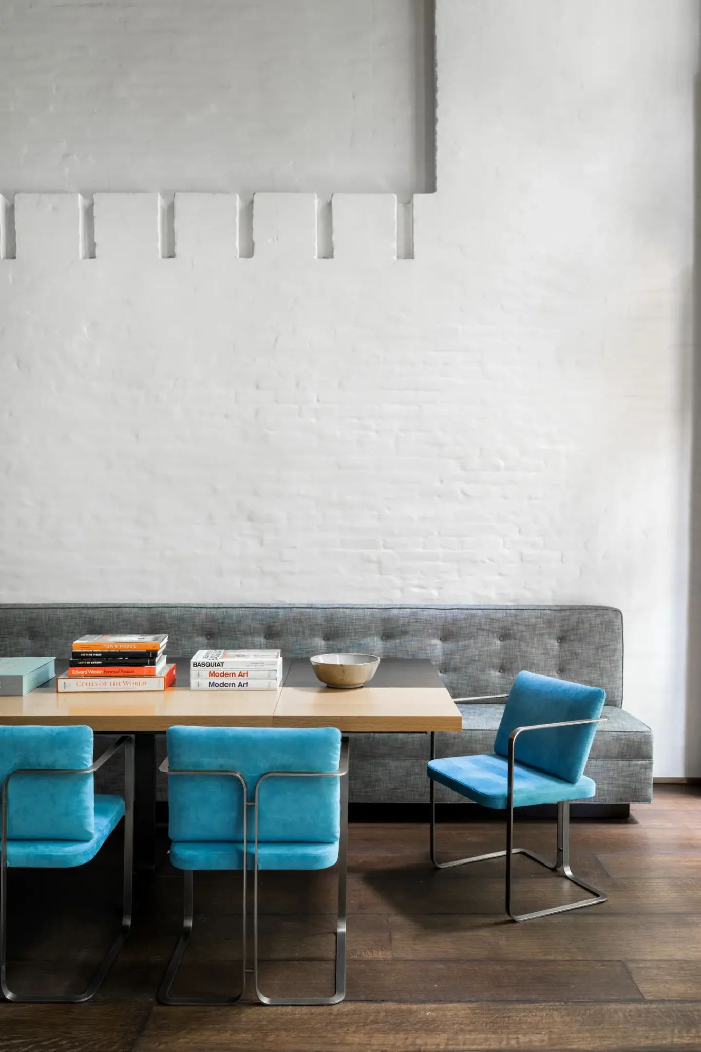 modern turquoise chairs in the dining room
