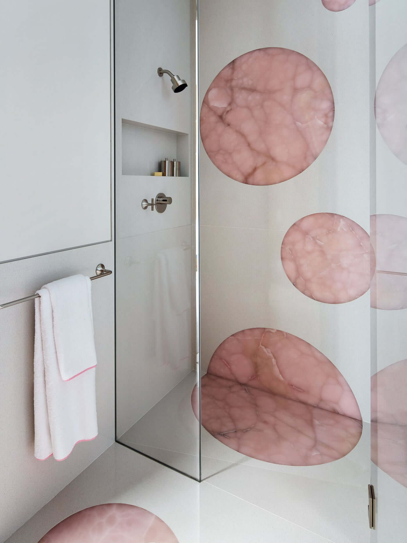 Natural Stone - Pink Onyx in a bathroom by StevenVolpe