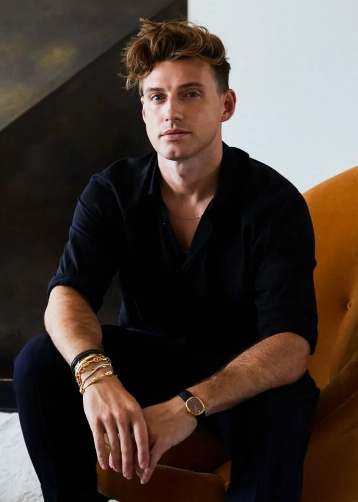 jeremiah brent in an orange armchair