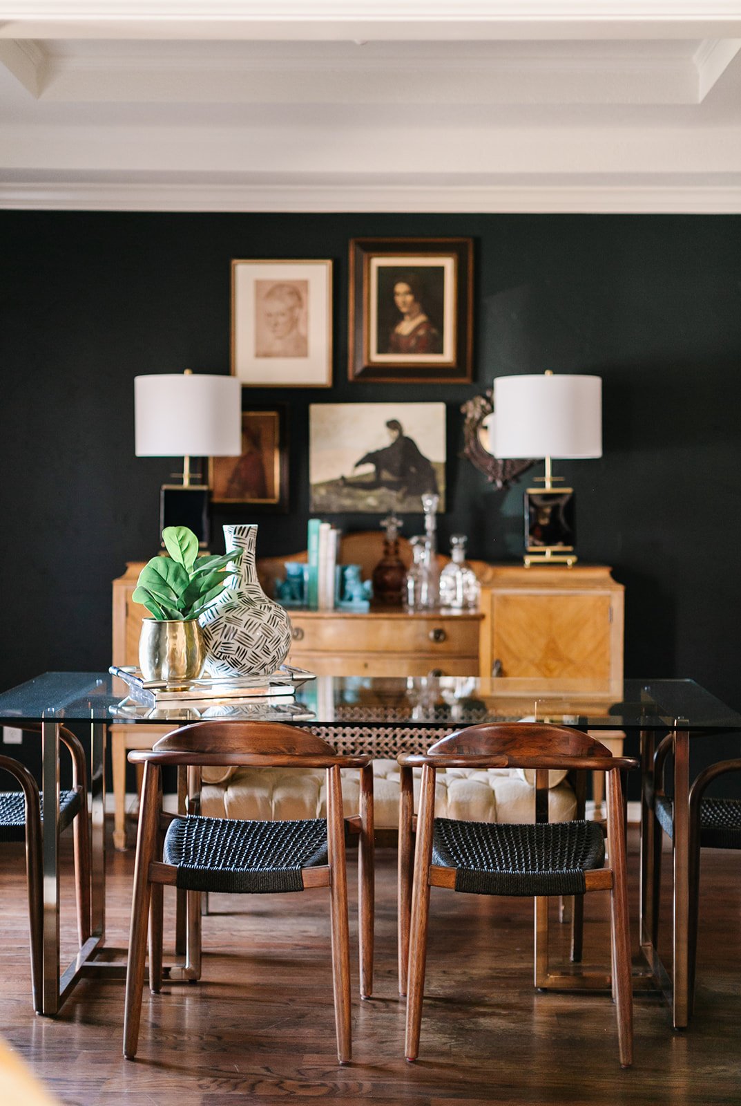 Dark green home office with wall art