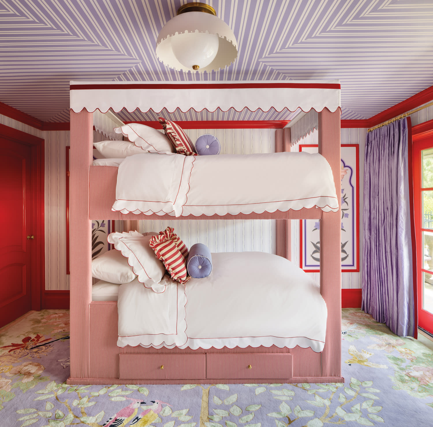 Eclectic interior design bedroom by HOMMÉS Studio featuring custom red-and-white striped bunk beds, lilac and red accents, and playful decor in a vibrant Jersey Shore beach house.