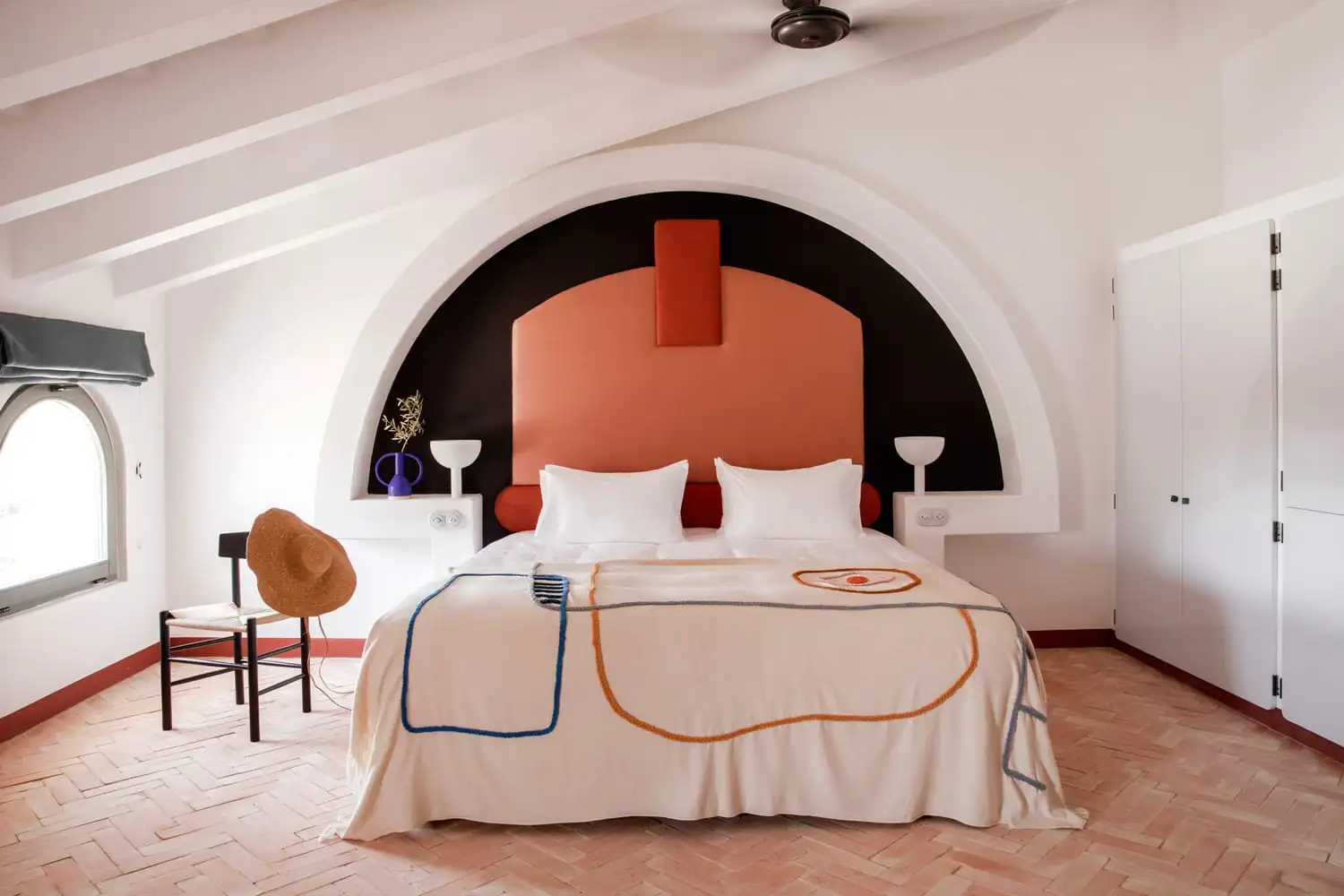 bedroom of the mediterranean hotel in menorca designed by Dorothée Meilichzon