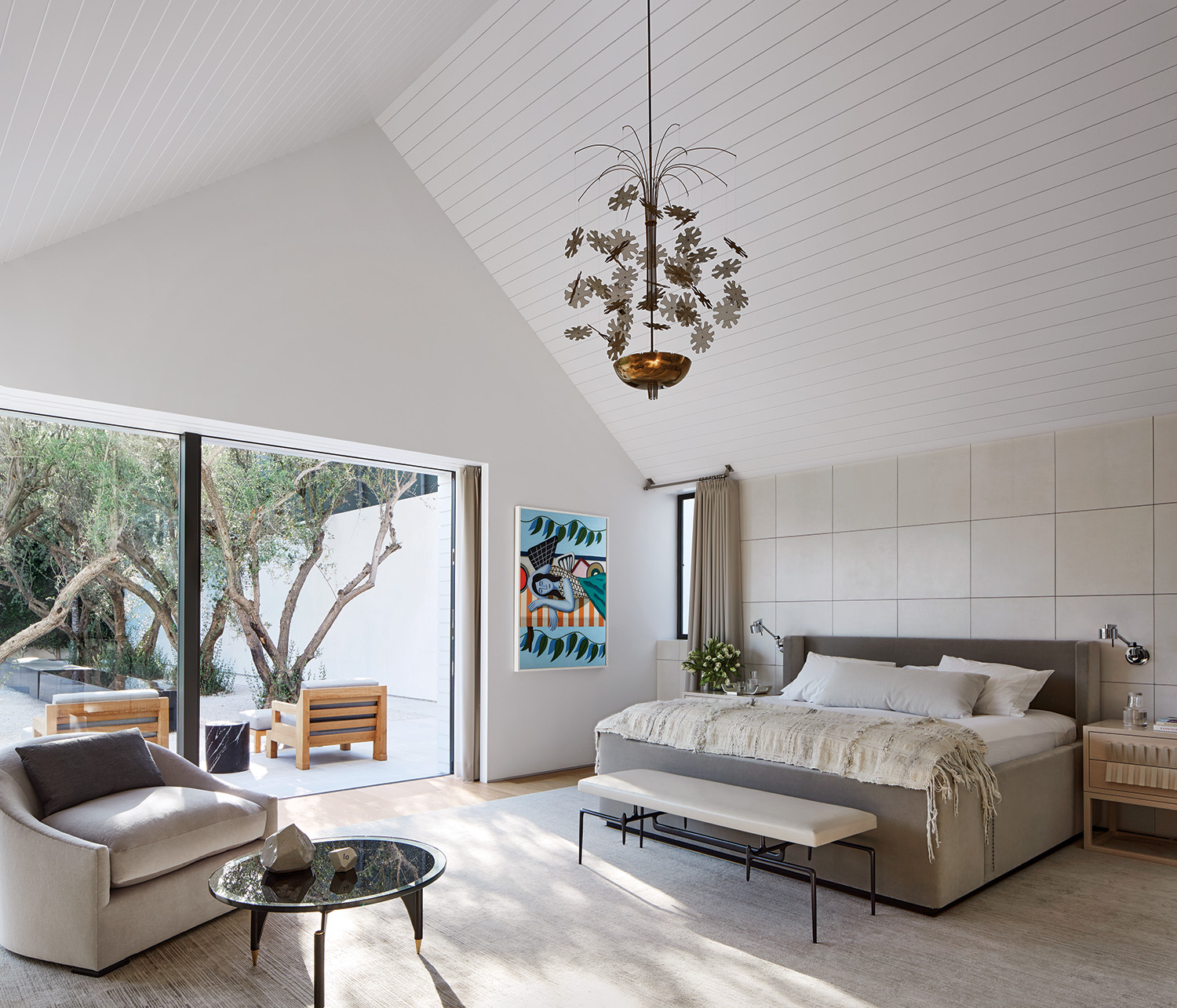 panels of parchment sheathe the wall behind the custom-designed bed in the bedroom