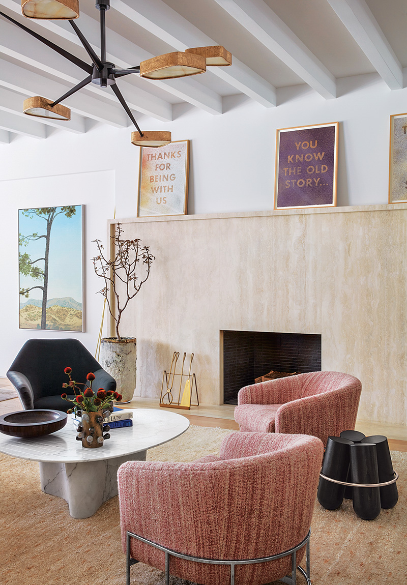 living room featuring two modern armchairs upholstered in baby pink fabric