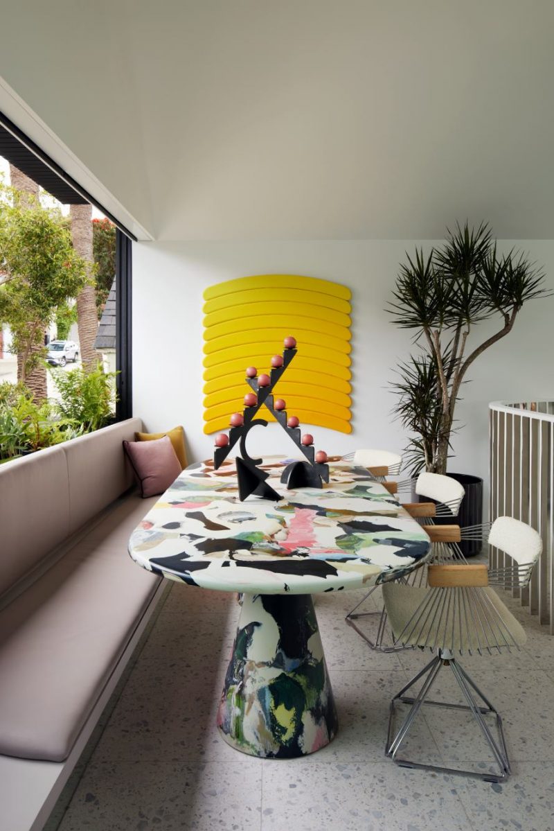 A multicolored abstract oval dining table