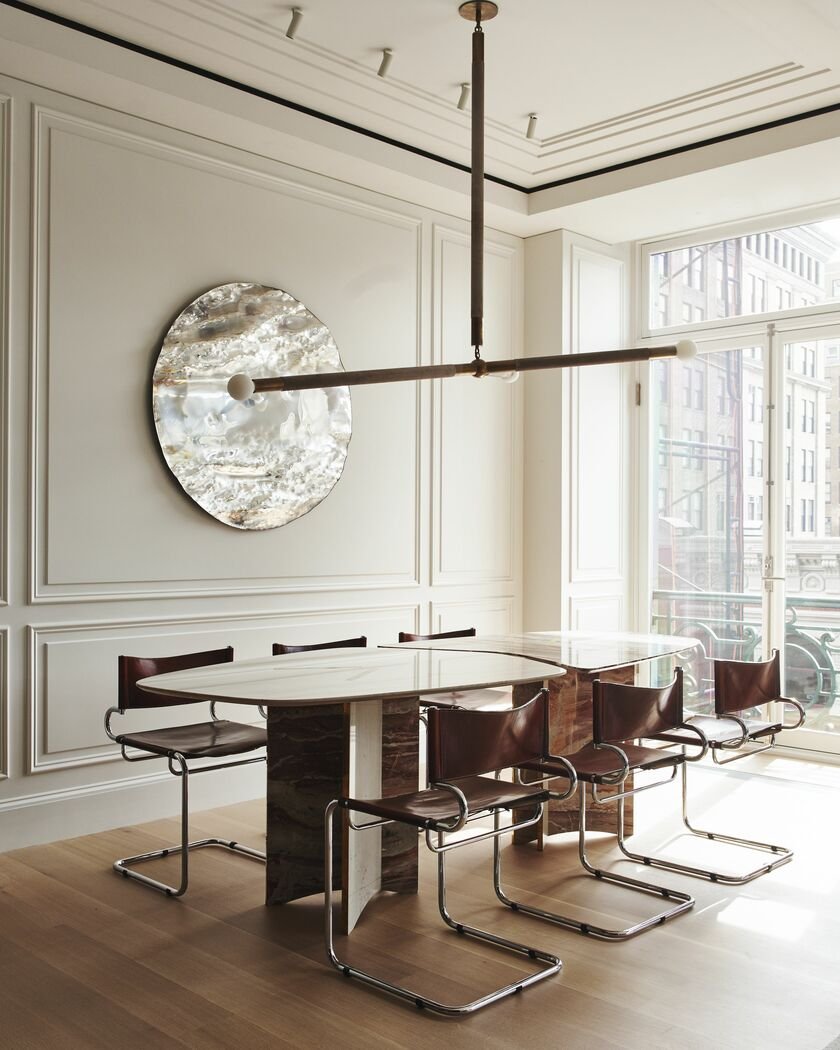 dining room featuring a modern wood dining table and a set of leather chairs