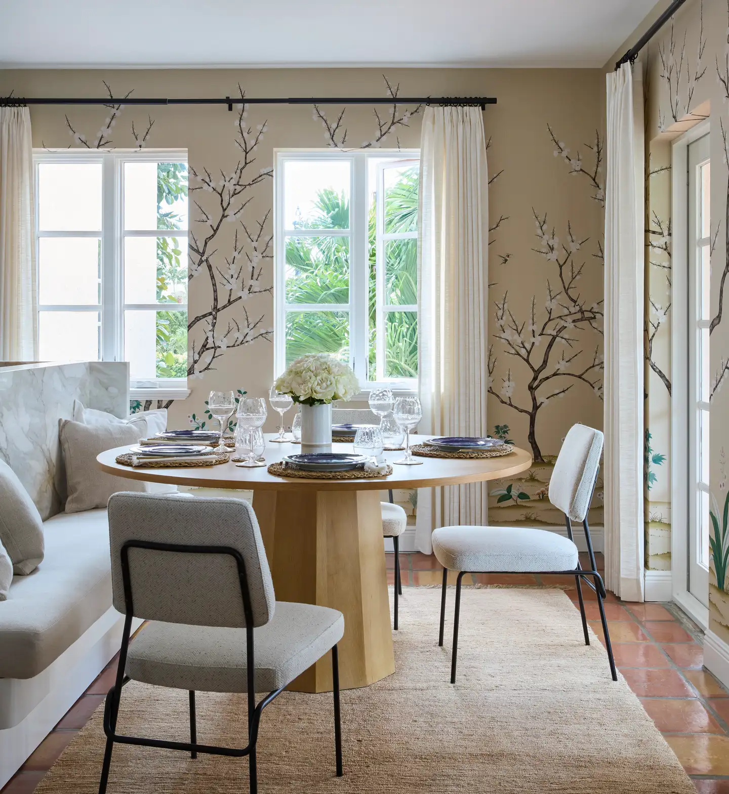 A dining room with a round table and chairs, creating a cozy and inviting atmosphere for meals.