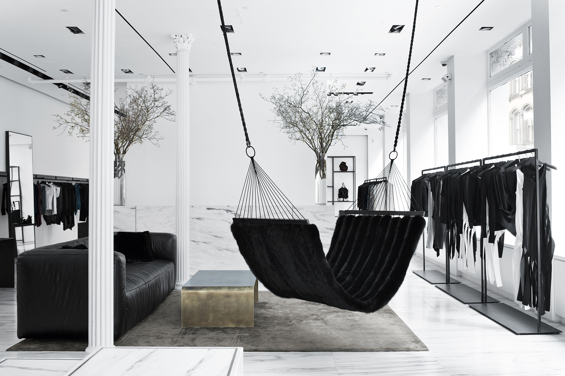 a marble counter and a unique black fur hammock