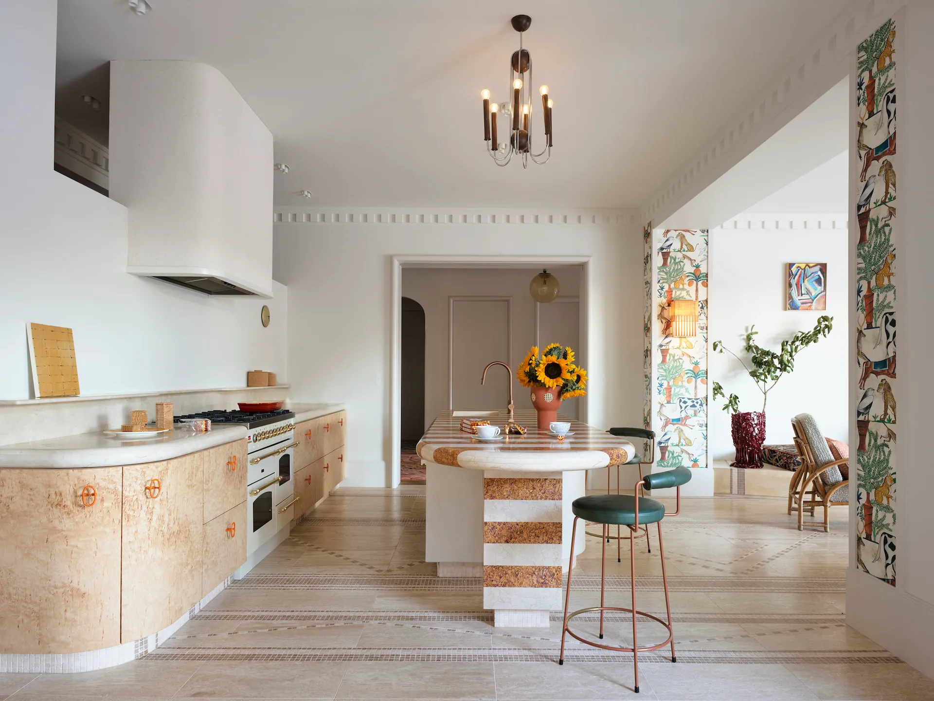 Kitchen featuring a kitchen island in Brocatello di Spagna marble and white travertine