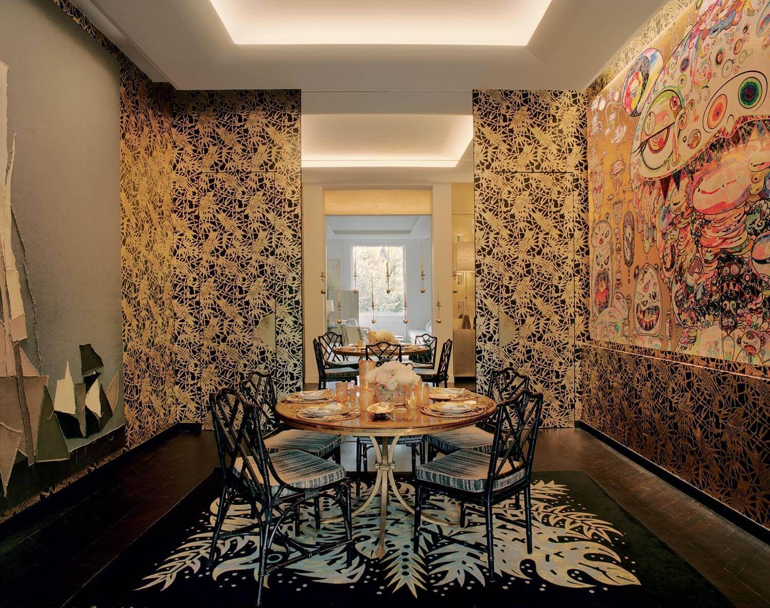 Maximalist dining room with Takashi Murakami panels
