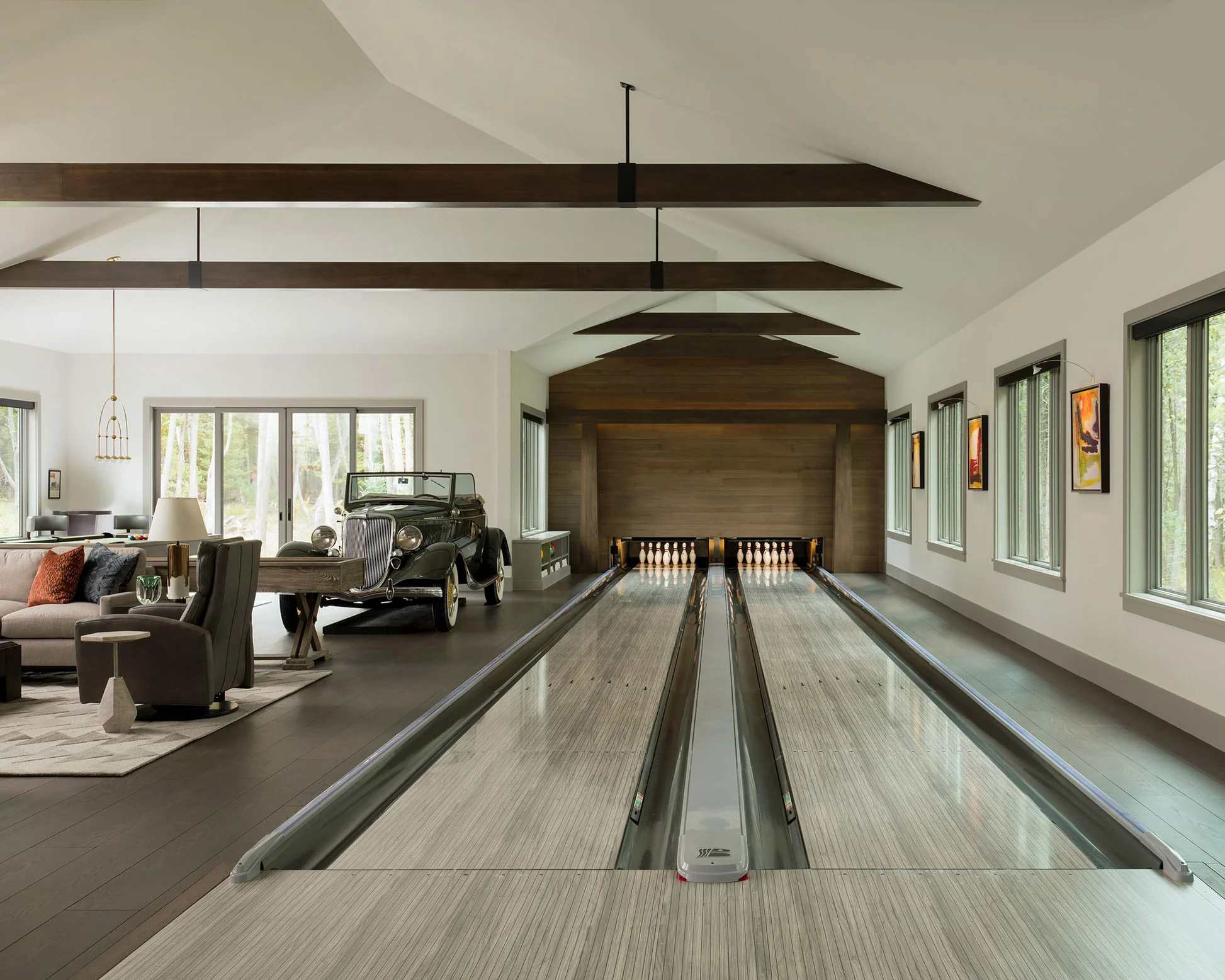 Living room with a bowling alley and a car, with brown hues