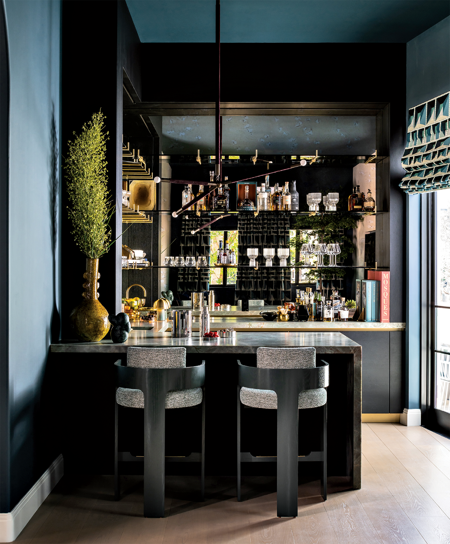 Explore Modern Miami: A Stunning Fusion of Old and New Design, a home bar with tall stools