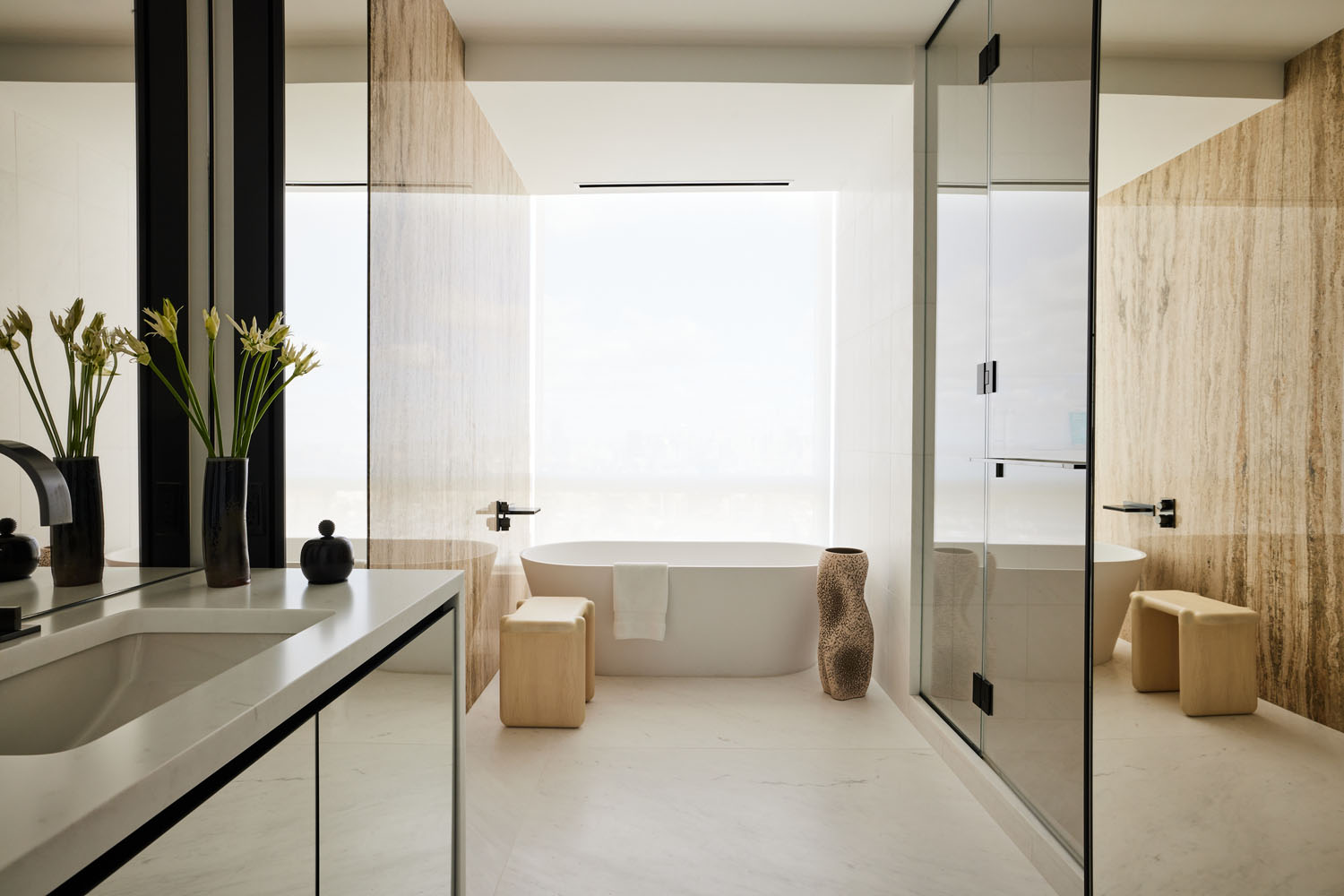 a modern bathroom in neutral tones and curvy style