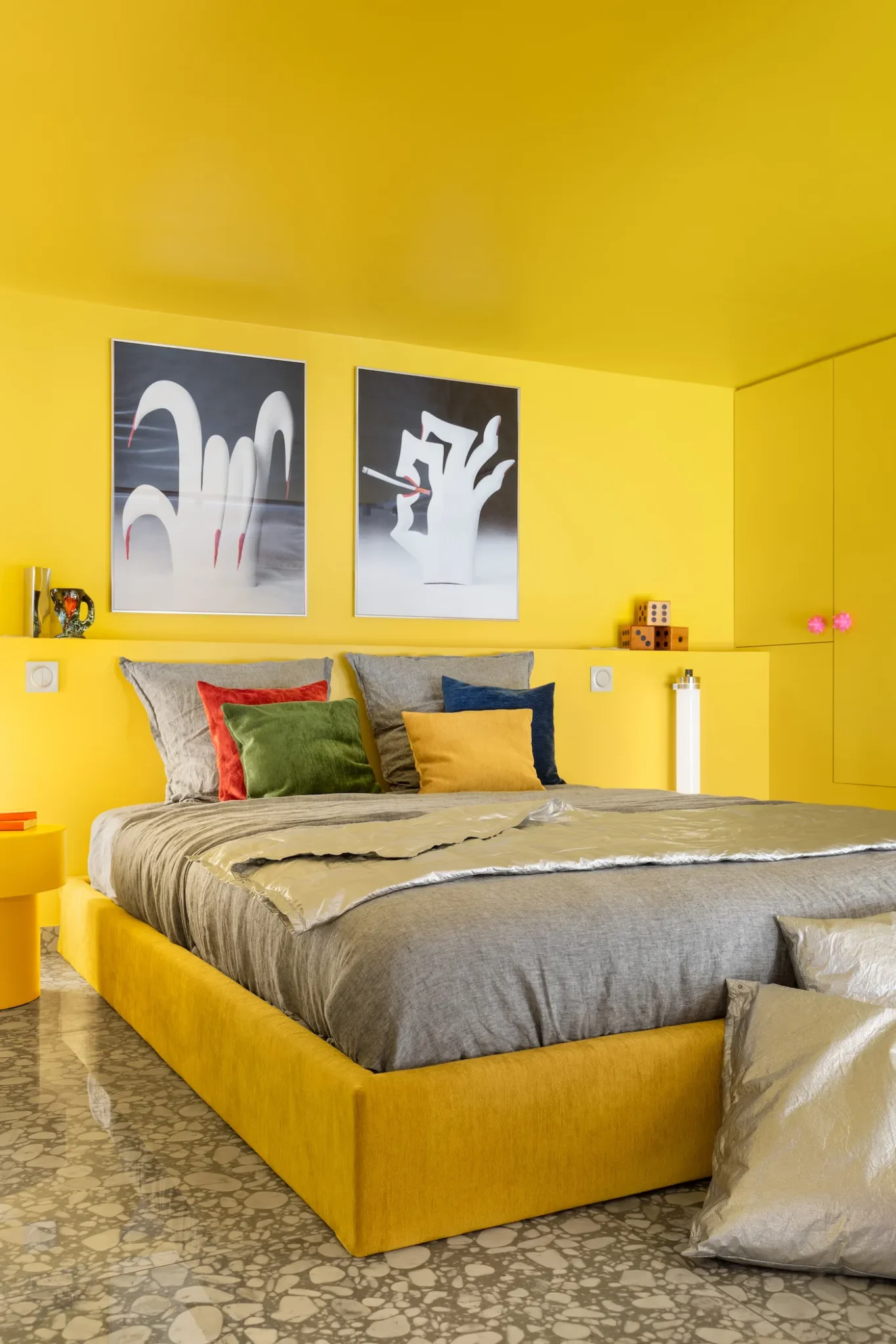 bedroom with a bright yellow color scheme 