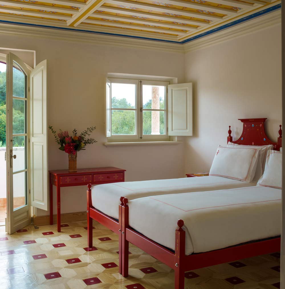 A guest room in red and yellow hues