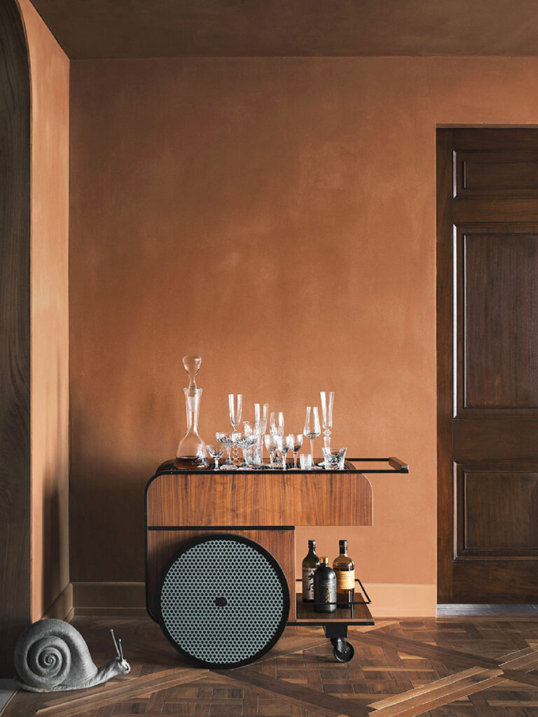 Luxury Interior Design, The dining room feels moody and intimate. Restored walnut parquet floors ground up the space, while earthy-toned walls and soft lighting invite lingering dinners. 