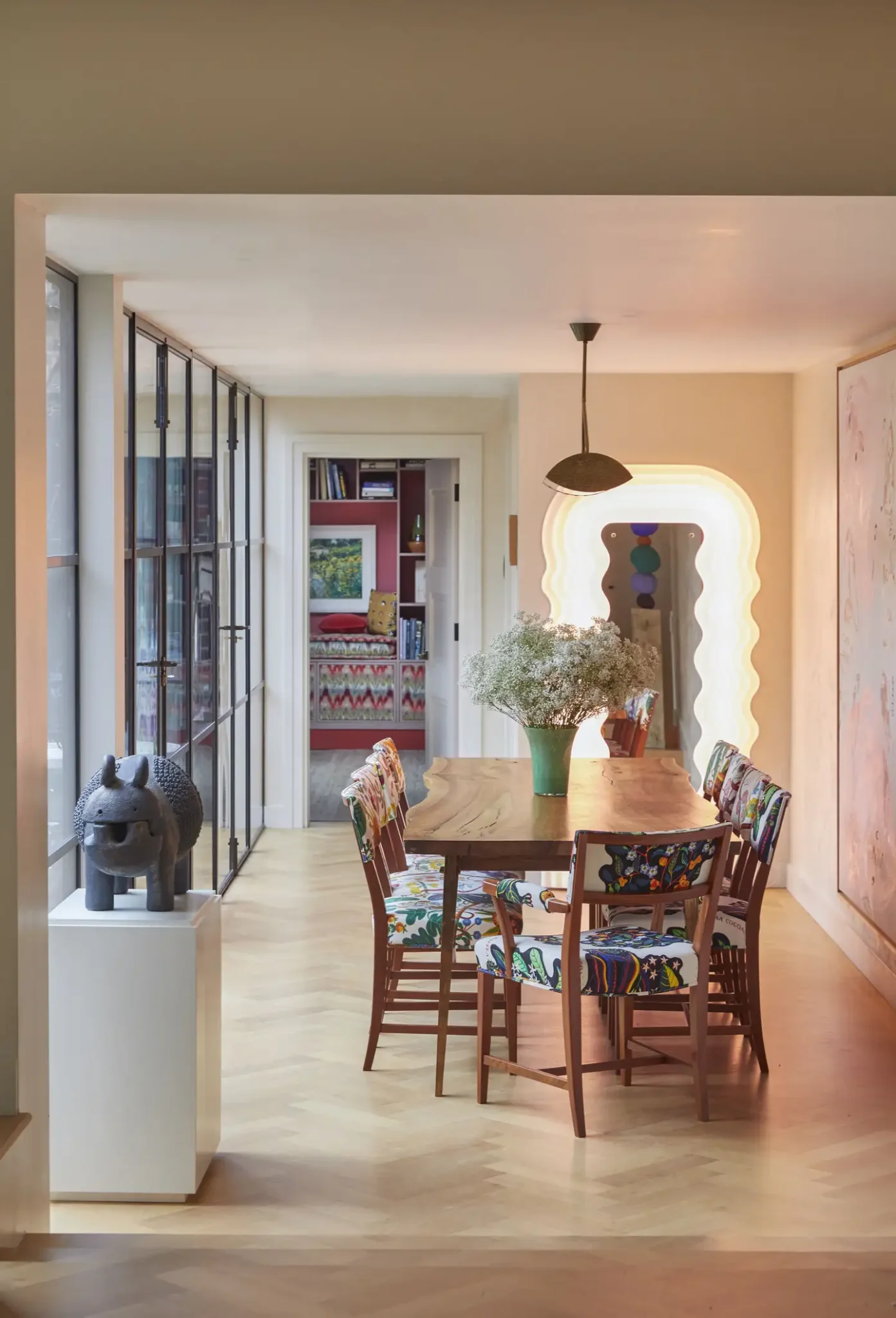 Eclectic dining room with a Memphis mirror