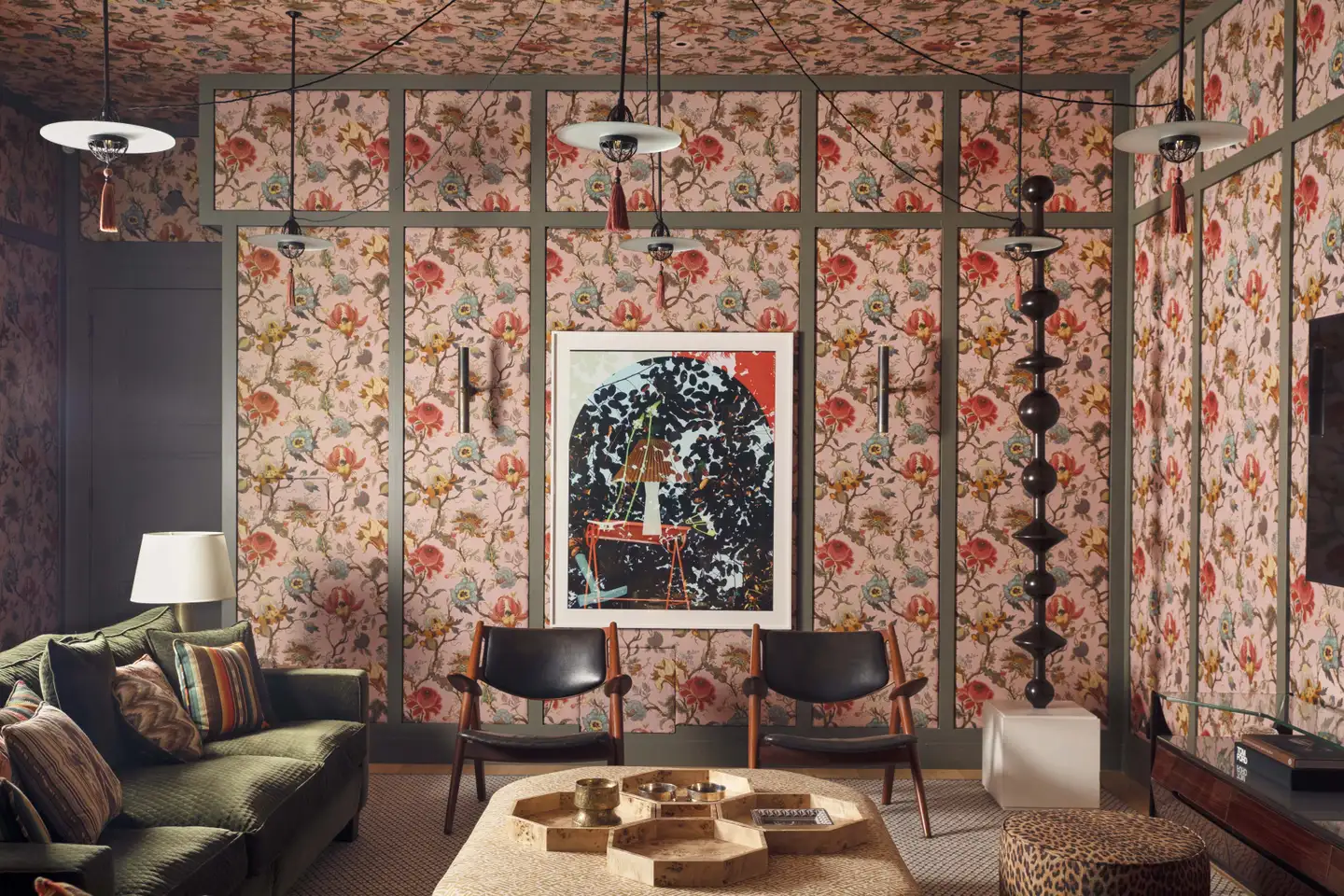 Living room with a flowered fabric covered wall