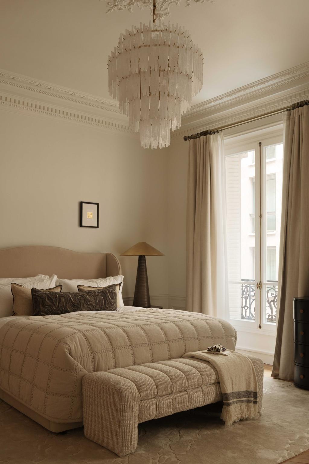 bedroom with a parisian interior design with lighting and neutral colors