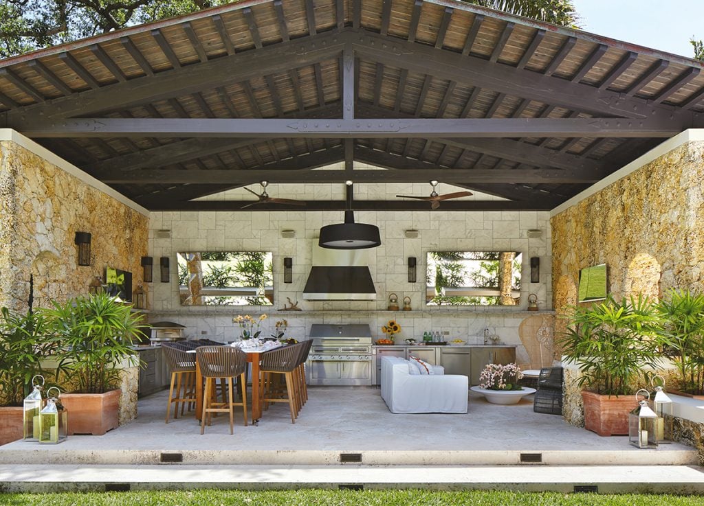 Full size luxury outdoor kitchen featuring an open space kitchen, living and dining area