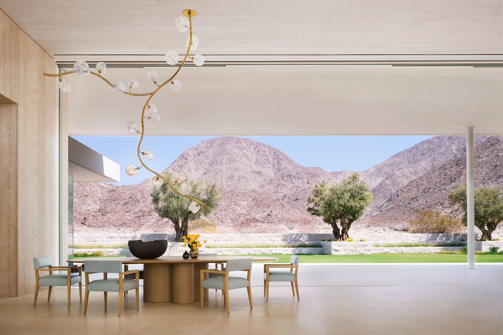 dining area with a custom table and leather chairs