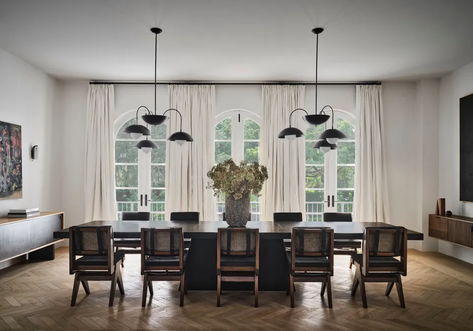 dining room with triple-dome chandeliers above the dining table