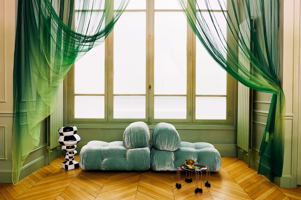 green velvet sofas in the dinning room area