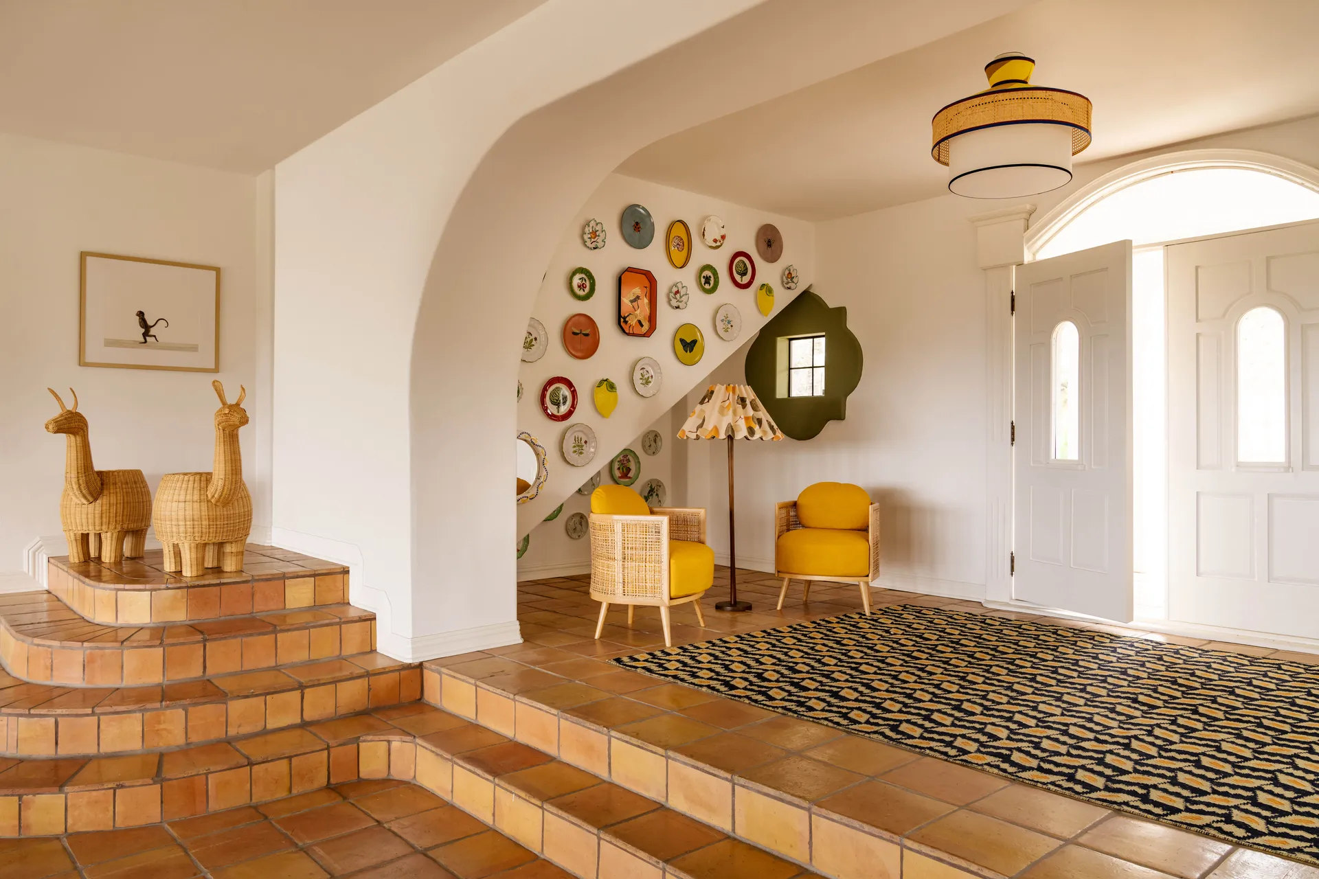 entryway with yellow, green, and terra-cotta hues and a wool rug