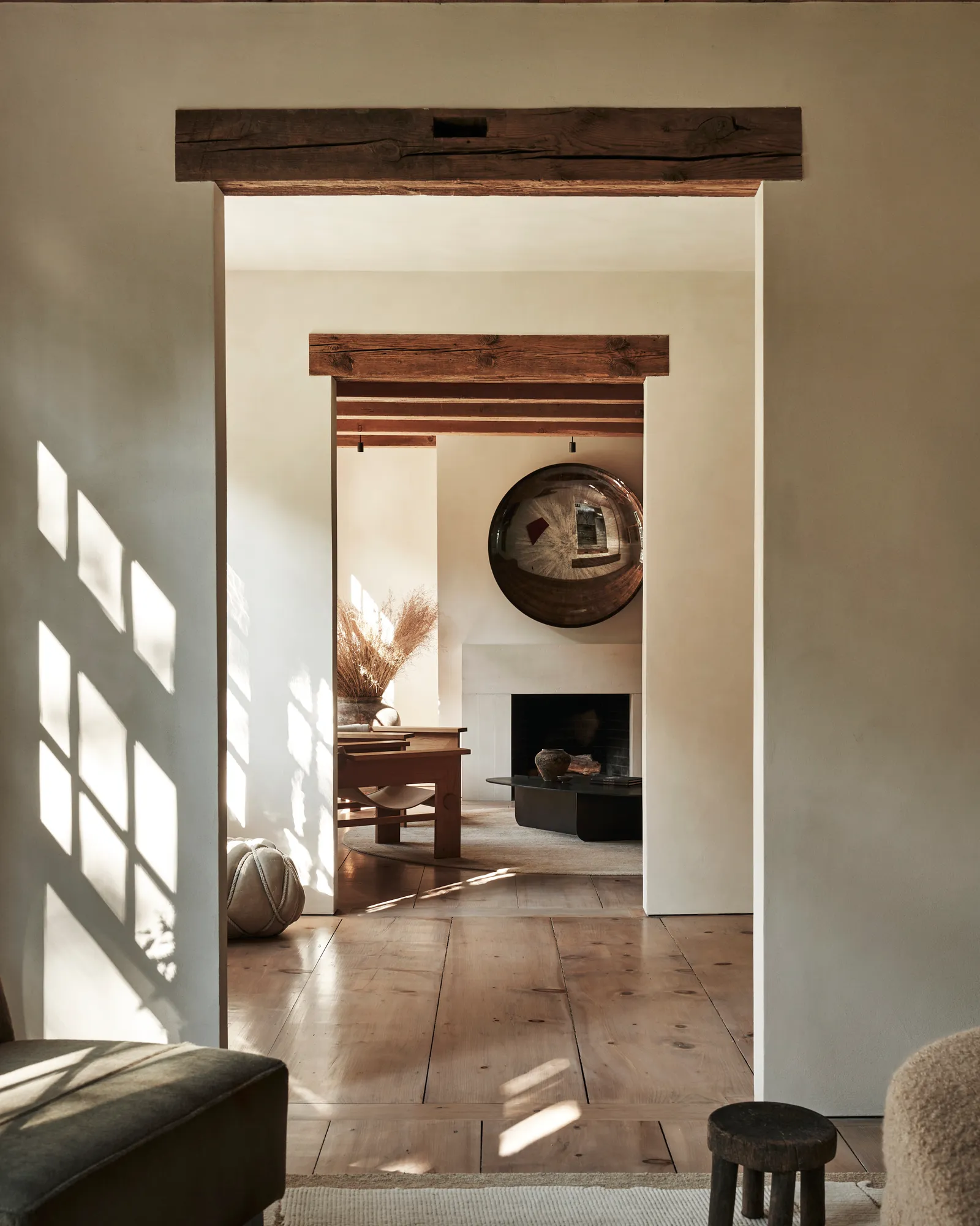 Entry with wooden floors and reclaimed beams