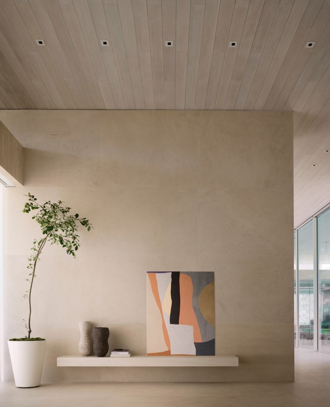 Entrawat with art painting and neutral colors wall