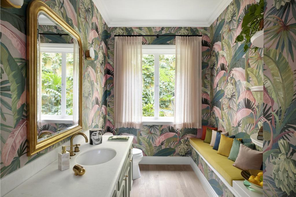 Bathroom featuring a colorful tropical wallpaper