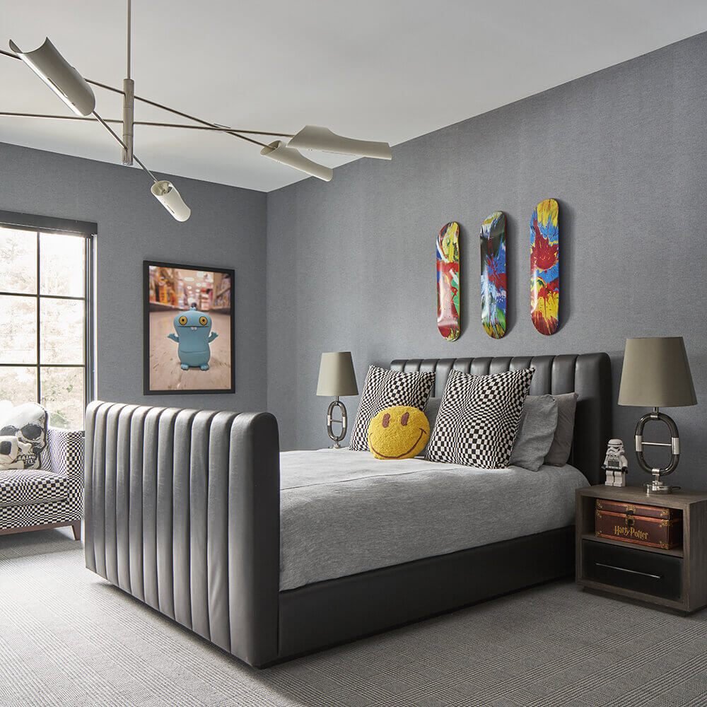 Modern interior in grey tone adorned with colorful contemporary art pieces